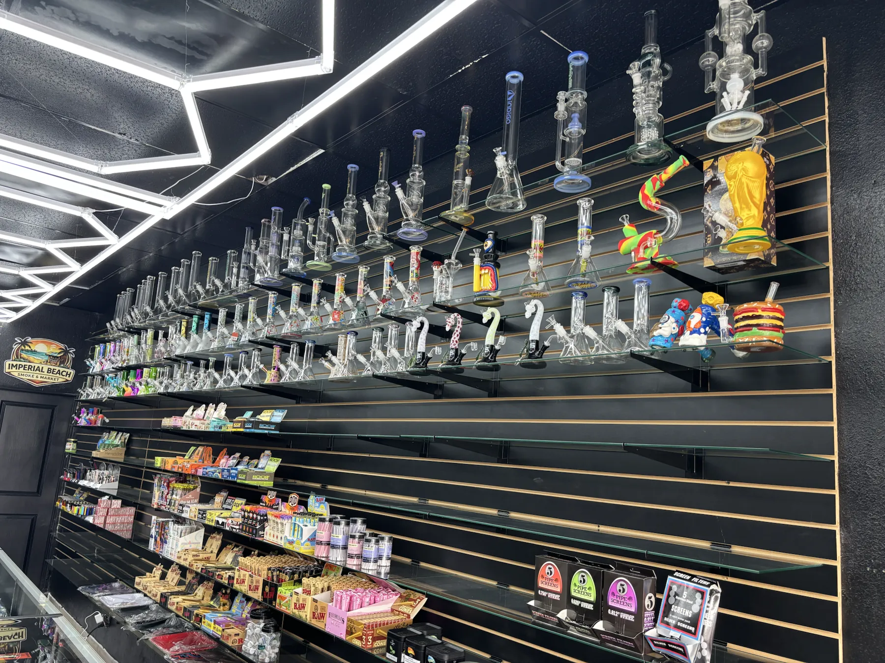 Large wall display of hand-selected glassware and smoking accessories