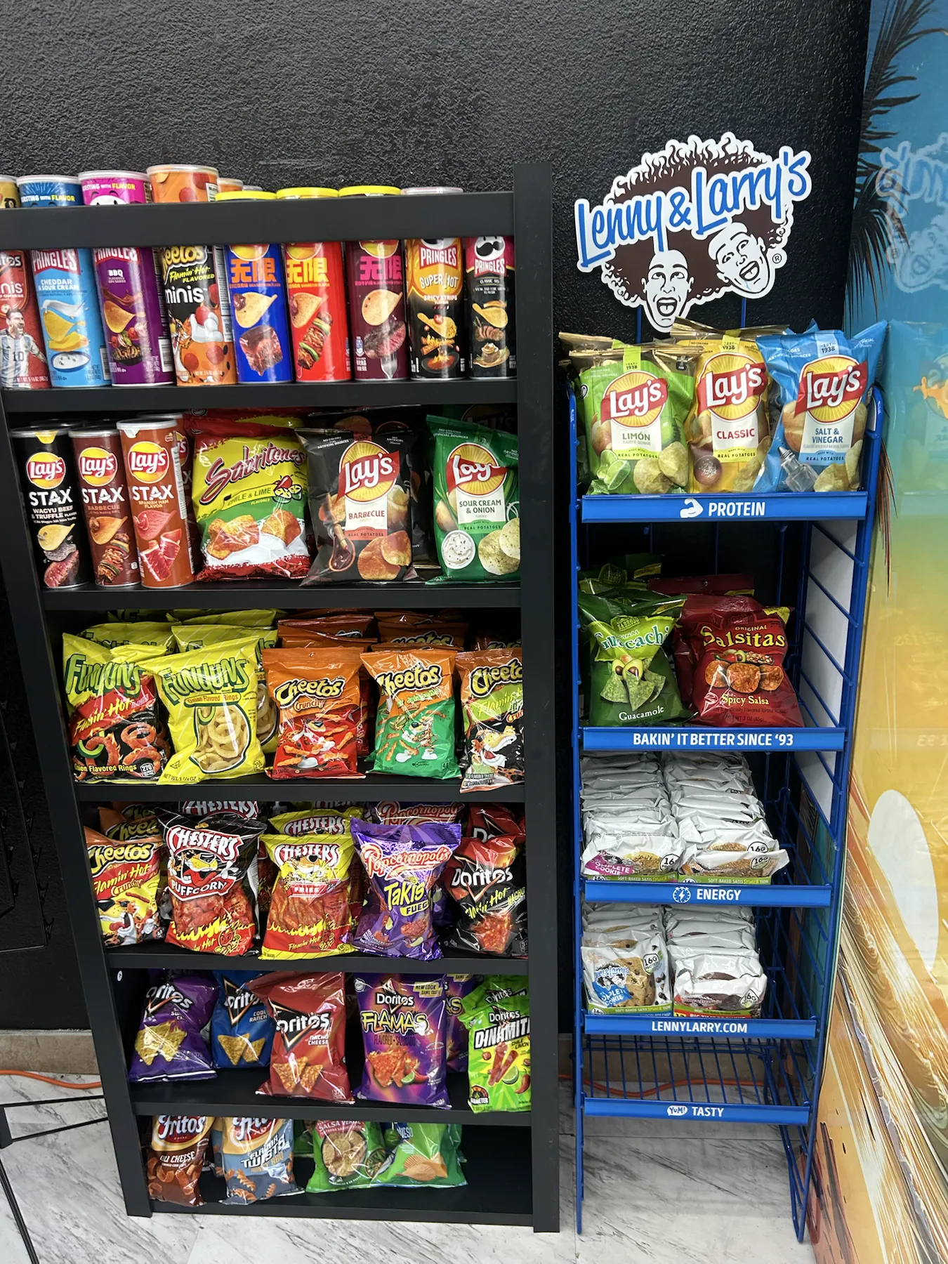 Colorful wall of chips and convenience-store snacks